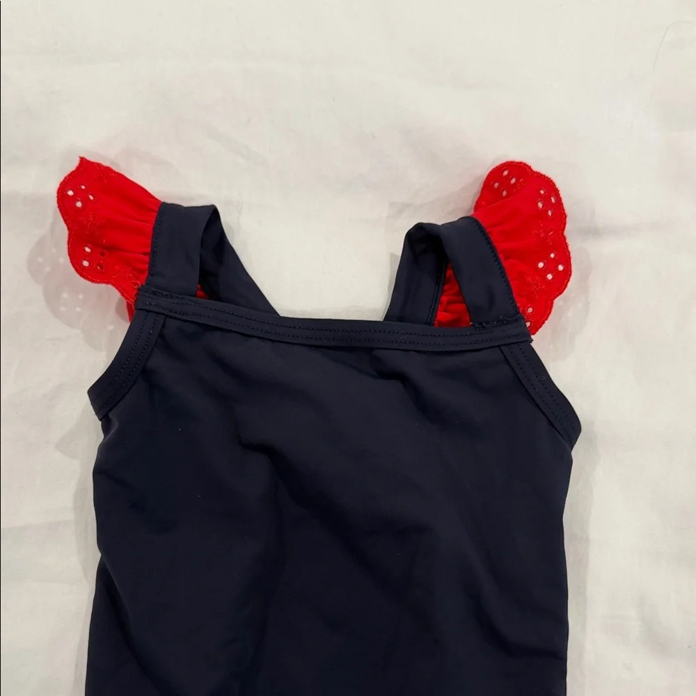 The Beaufort Bonnet Company Navy One-Piece Swimsuit with Red Ruffle Straps